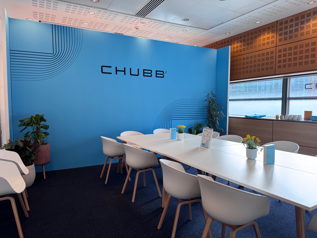 Chubb meeting room with table and blue wall
